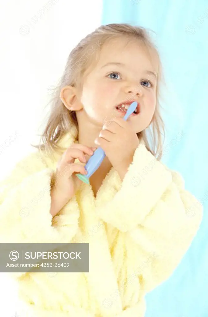 Little girl brushing her teeth