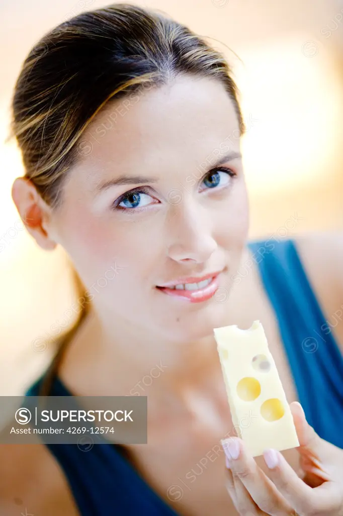 Woman eating gruyere.