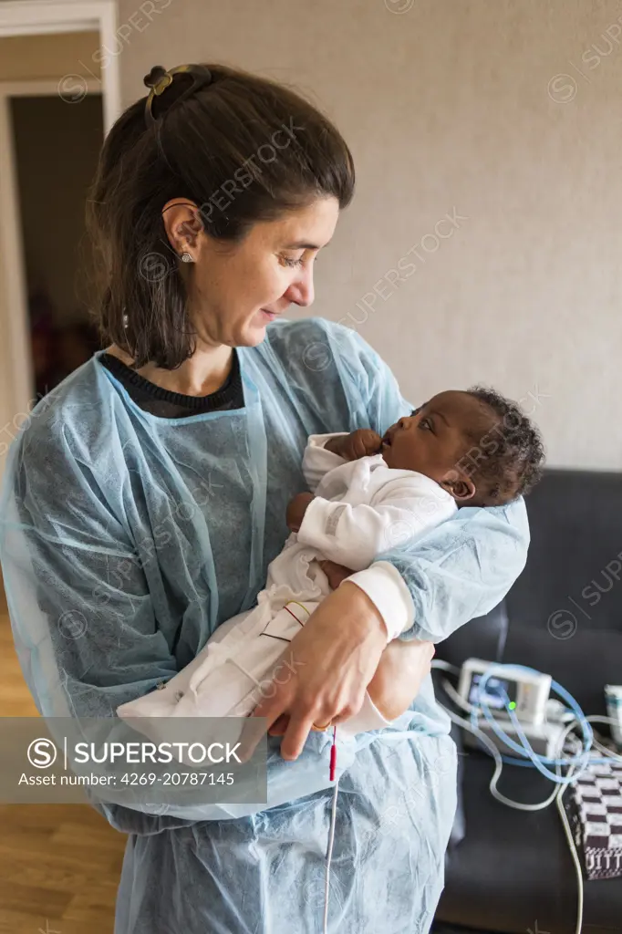 Nurse home visit from a baby born premature, Home medical care department of Limoges hospital, France.