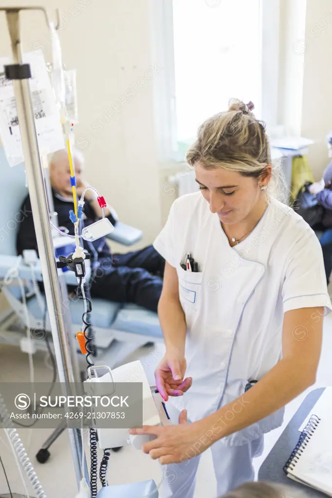 Oncology department, Patient with cancer receiving chemotherapy in day hospital, France.