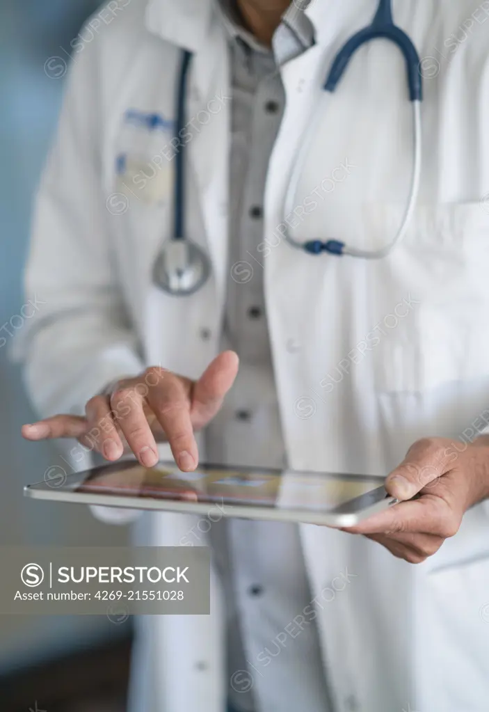 Doctor using a digital tablet.