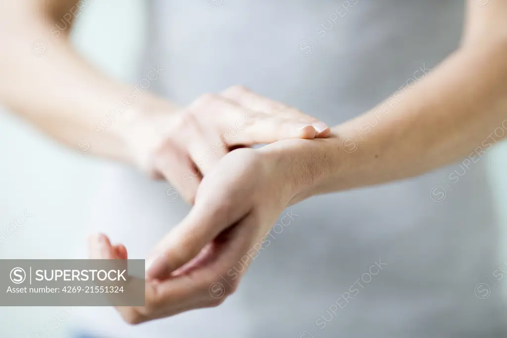 Woman checking pulse.