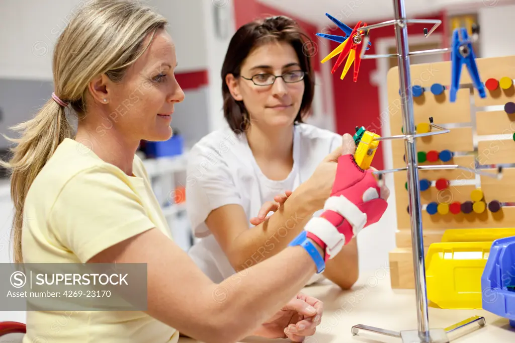 Functional rehabilitation of a hemiplegic woman. Occupational therapy session. Department of Physical Medicine and Rehabilitation, Limoges hospital, France.