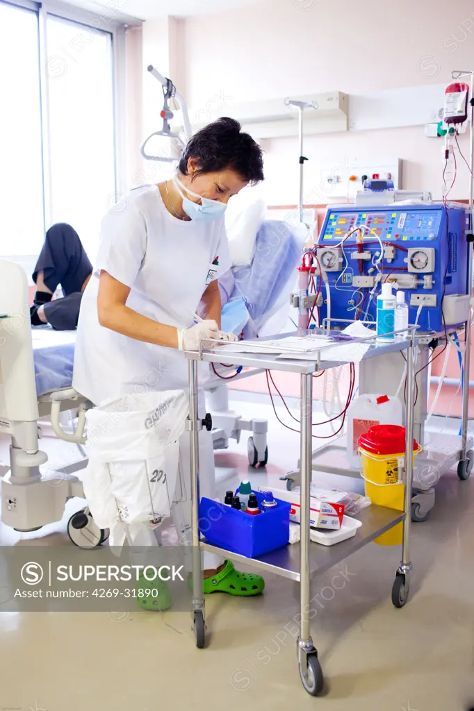 Blood transfusion of anemic patient during a hemodialysis session. Nurse according to the protocol control Transfusion. Limoges hospital, France.