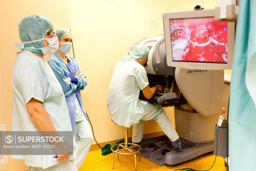 Prostatectomy performed by the telesurgery robot Da Vinci, which four articulated arms and camera are controlled at distance by a surgeon. Limoges hospital, France.