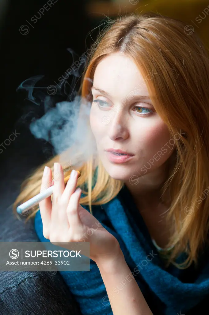 Woman smoking electronic cigarette.