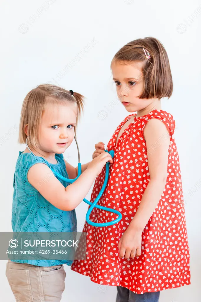 Children playing with a toy stethoscope