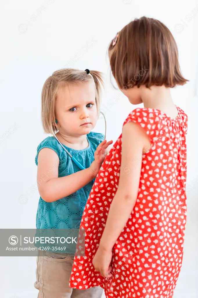 Children playing with a toy stethoscope