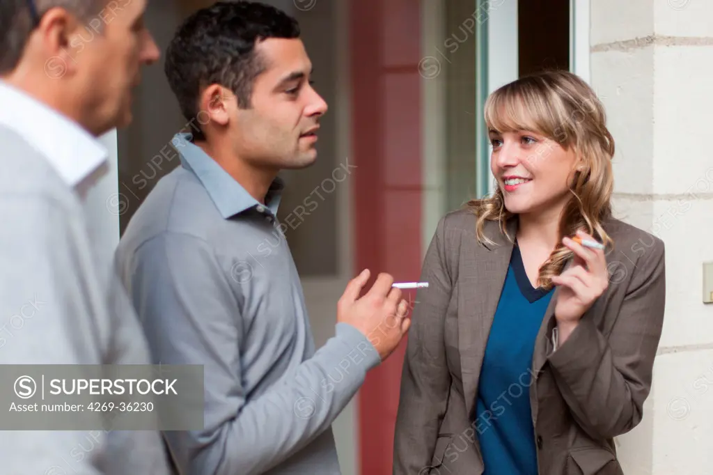 Office workers smoking outside