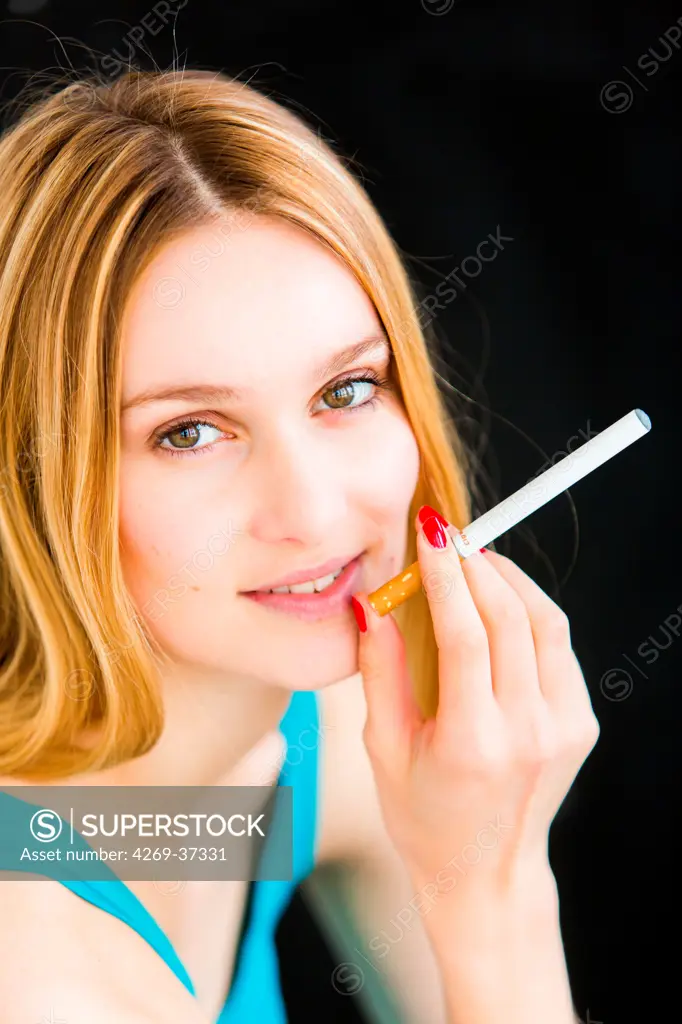 Woman smoking electronic cigarette.