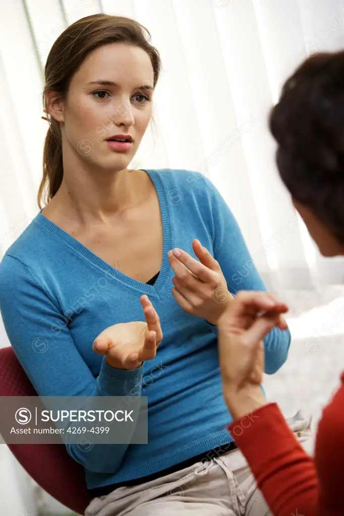 Two women talking.