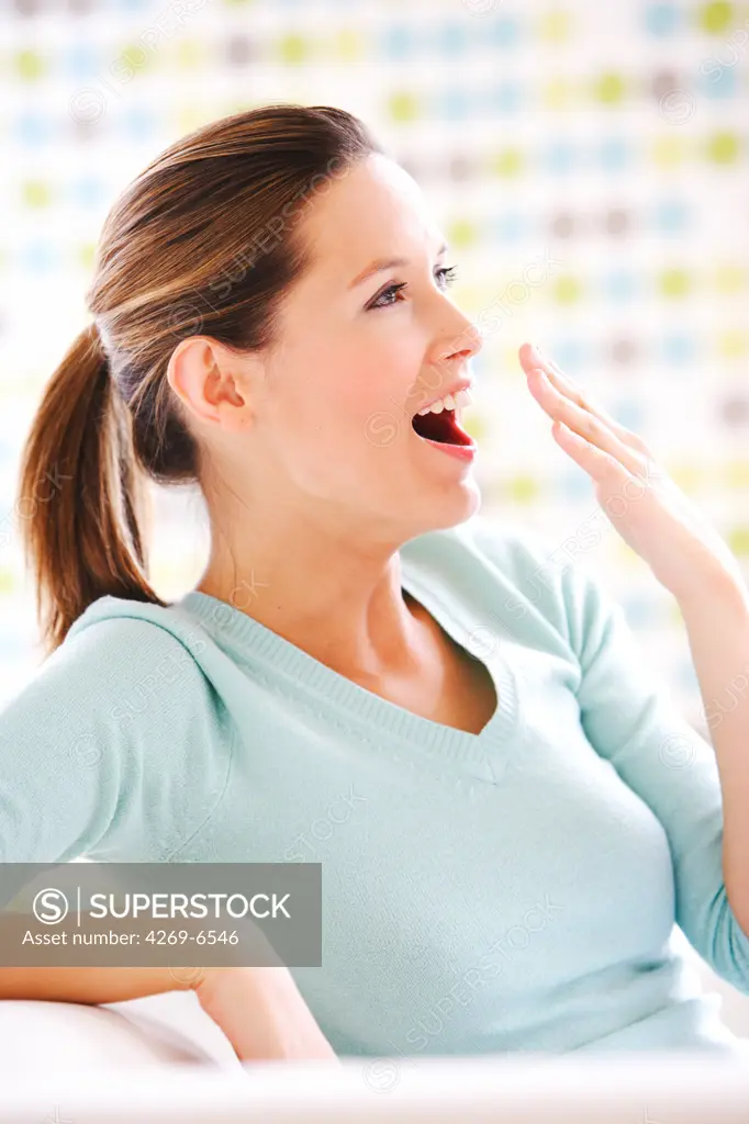 Woman yawning.