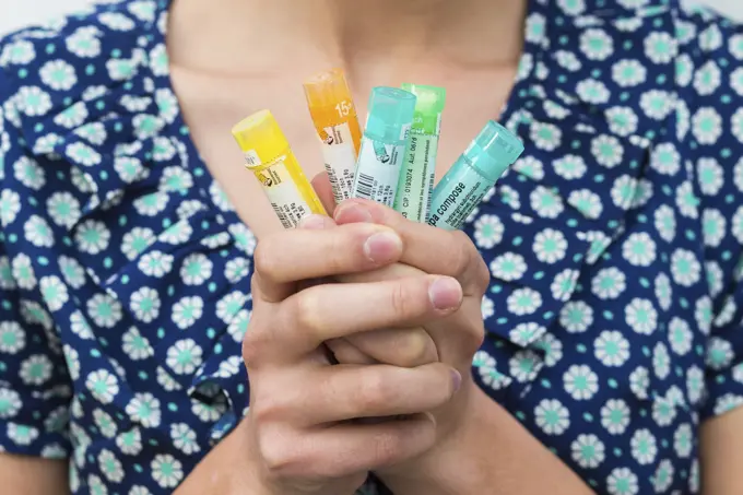 Woman taking homeopathic medicine.