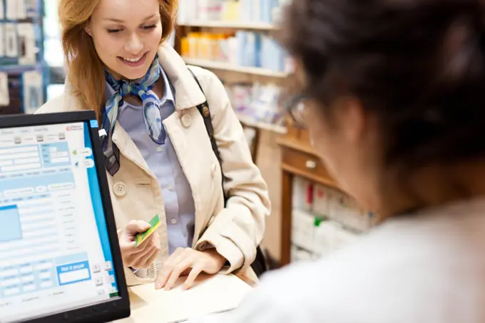 Pharmacy. Woman buying medications in a pharmacy.