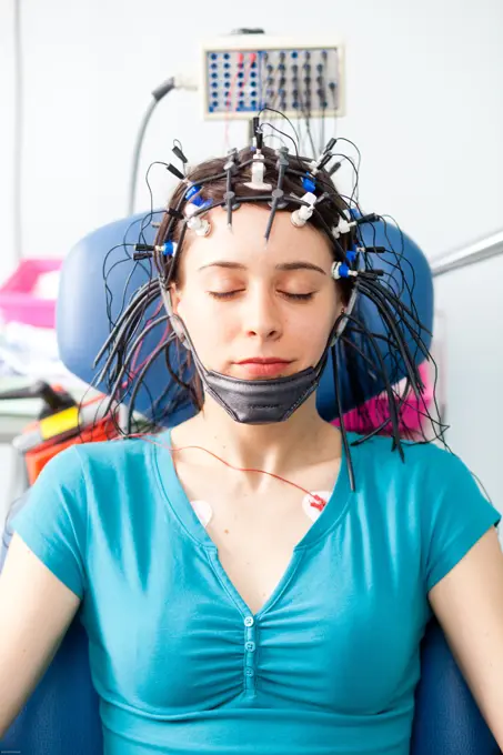 woman undergoing an electroencephalogram (EEG). Limoges hospital, France.
