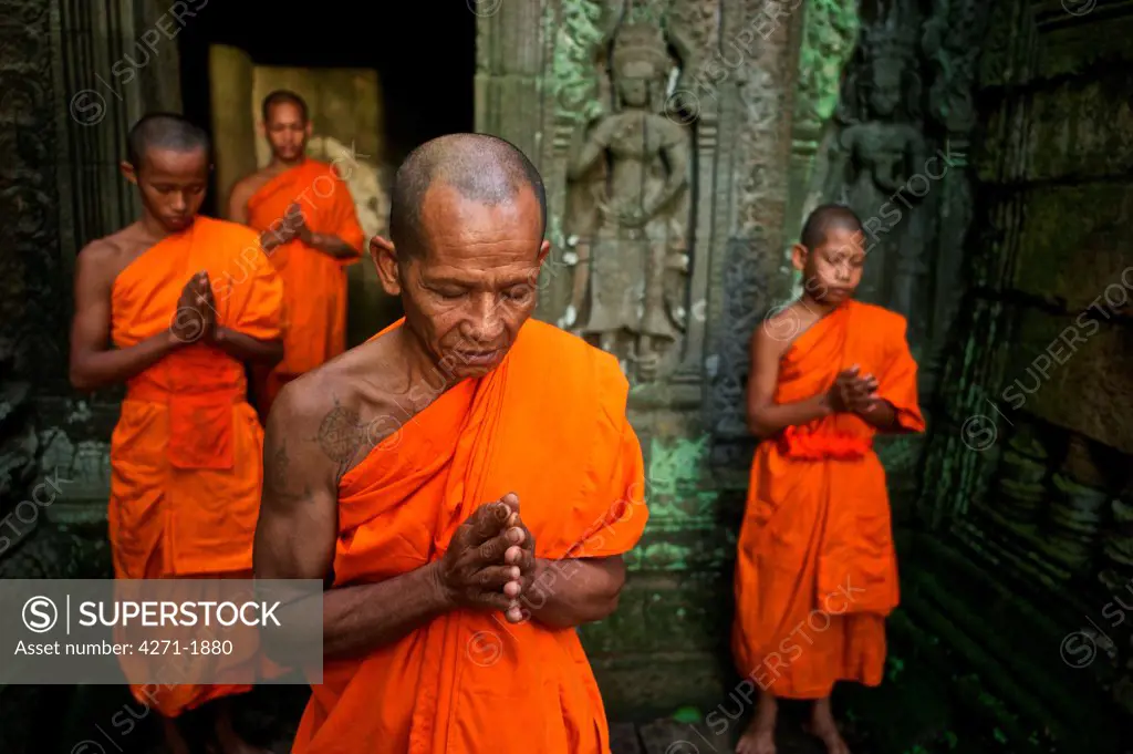 Theravada Buddhists from Phras Ang Tep Monastery at Ta Prohm Jungle Temple (Angkor Complex)