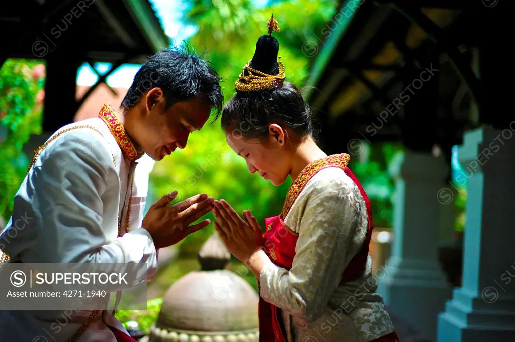 Bride and groom wearing a Lao traditional wedding Gown. Groom: Phoun Savath Bride: Many Lao