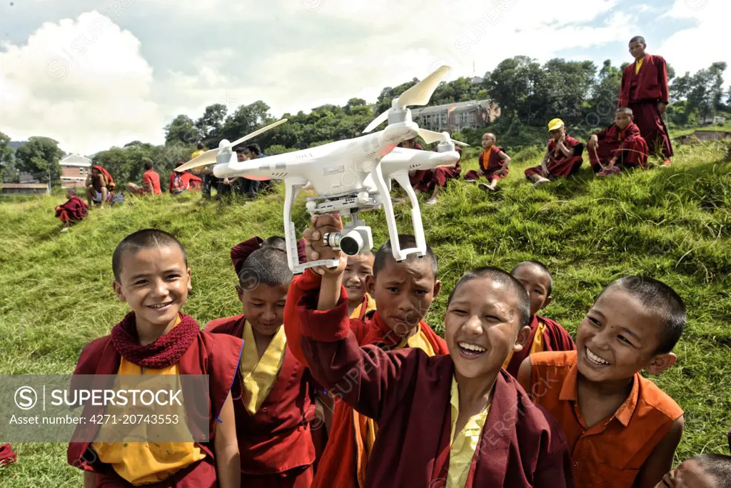 Local Nepalis learning the basic of drone flying at a humanitarian workshop