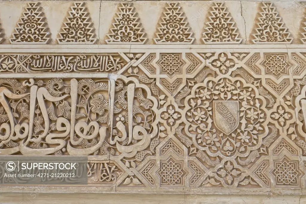 Arabesques around a window. The Alhambra Palace