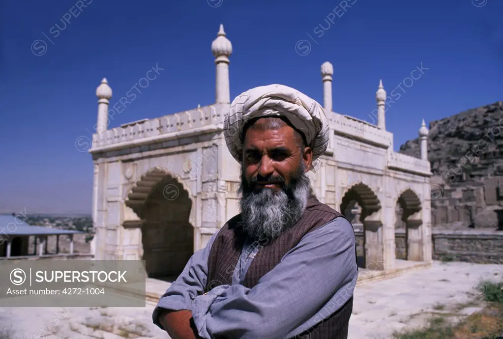 Afghanistan, Kabul. The engineer at the marble pavilion in the grounds of Babur's garden, on the slopes of a hill called Sher-Darwaza, Kabul. The tomb of Babur (1483-1530), founder of the Mughal dynasty lies in this garden. When Babur died in 1530 his remains were bought to Kabul from Agra in fulfilment of his instructions, and he was laid to rest in a simple tomb