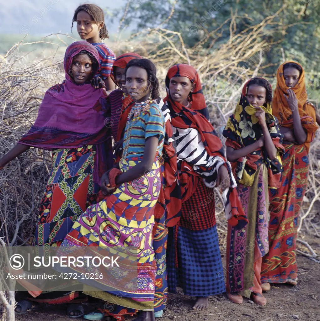 Afar girls wear brightly-coloured clothes and have attractive hairstyles, which are typical of the young girls of their tribe. Proud and fiercely independent, the nomadic Afar people live in the low-lying deserts of Eastern Ethiopia.;