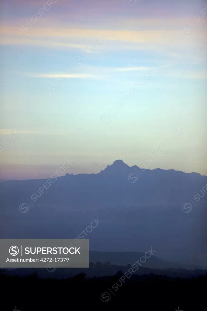 Kenya, Kenya Highlands. Dawn over Mount Kenya which rises 17,058 feet above sea level on the equator. Mount Kenya is the second highest mountain in Africa.