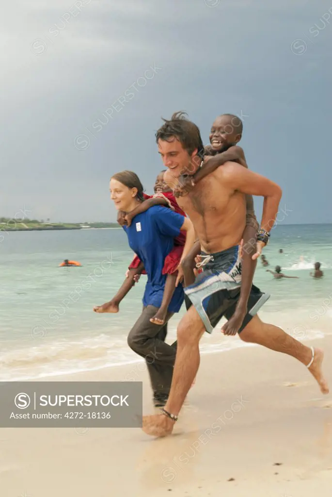 Volunteers playing with local children, Mombasa, Kenya