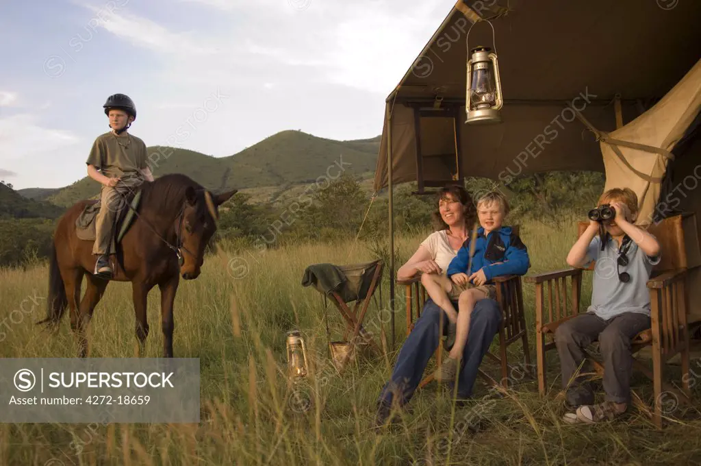 Kenya, Chyulu Hills, Ol Donyo Wuas. Family on a riding safari with Ride Africa in the Chyulu Hills. (MR)