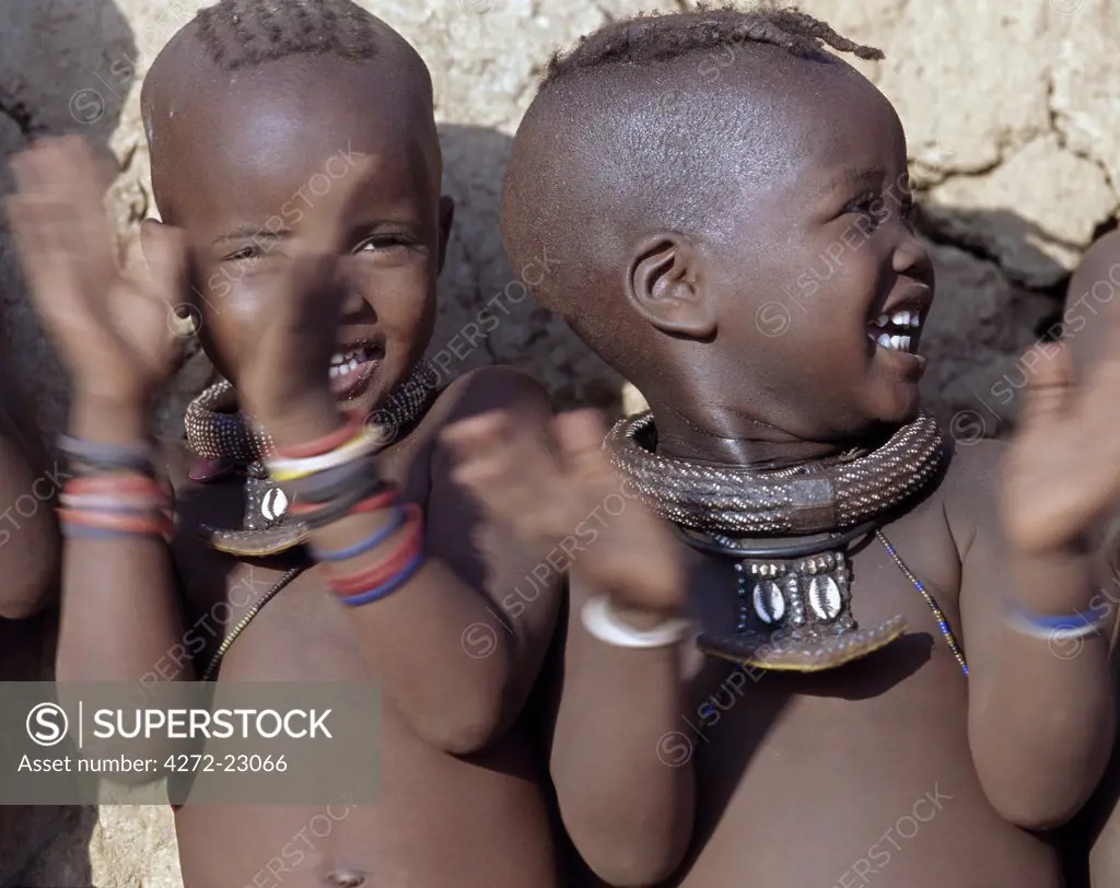 Smiling Himba girl with traditional jewelry