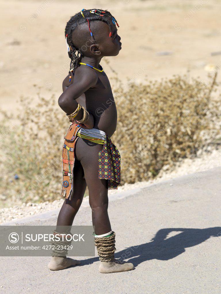 A young girl from Angola at Opuwo, an important administrative centre of  the Himba. Many people living in southern Angola are Herero-speaking Bantu  nomads like the Himba although they dress in differently. -