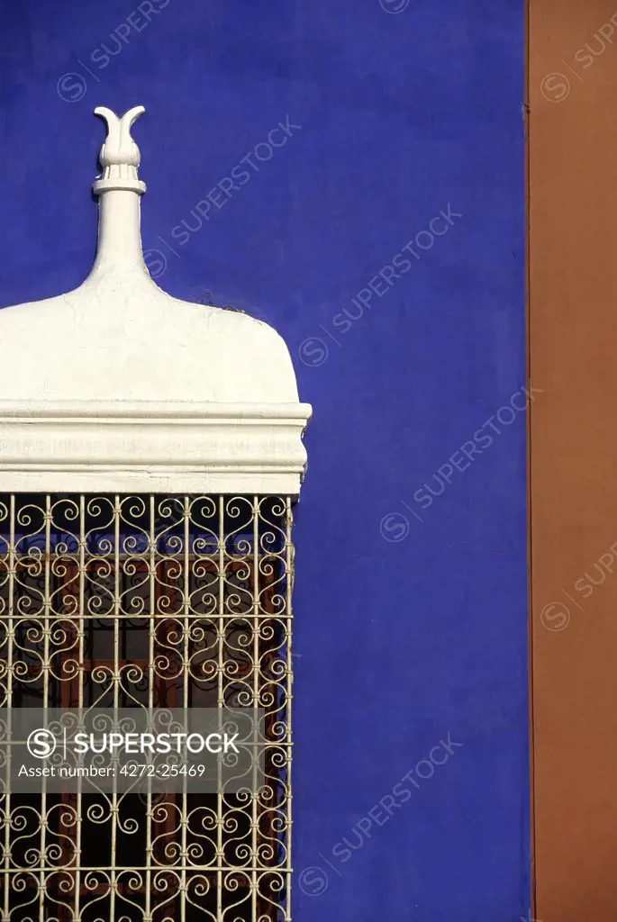 Wrought iron grillwork and pastel shades of a colonial mansion on the Plaza de Armas in Trujillo, Peru. The city in Peru's north, was founded by Francisco Pizarro in 1535.