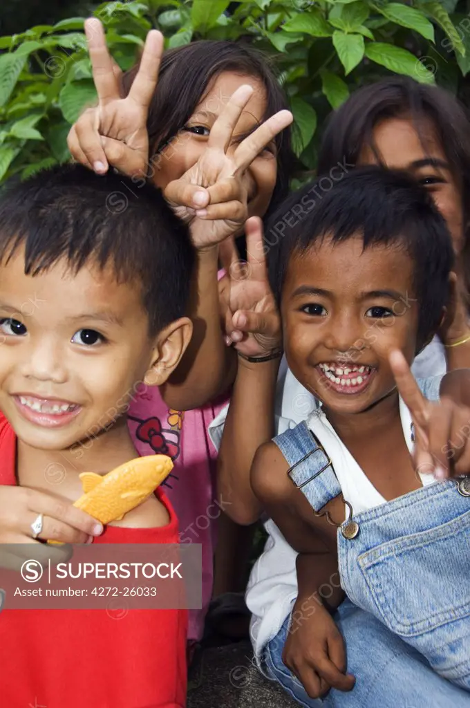 Philippines, Luzon, Manila. Children having fun in Rizal Park.