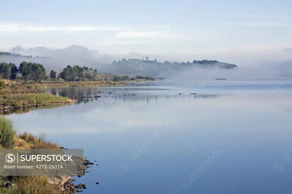 Portugal, Beira Alta, Penedono. A tranquil dawn overlooking a lake near Penedono in the Beira Alta region in Northern Portugal.