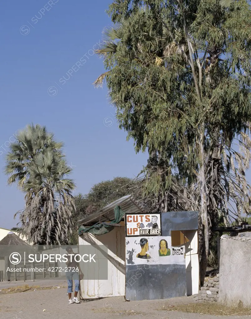 The signs outside a small barber's shop in Maun, the safari capital of Botswana and the gateway to the hugely popular Okavango Delta.