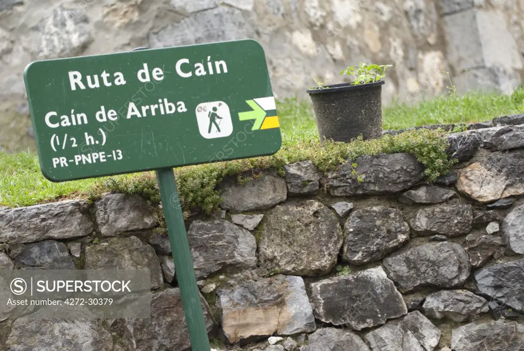 Sign in the village of Cain at the start of the Cares Gorge walk. The Cares Gorge separates the central and western massifs of the Picos. Picos de Europa, Northern Spain