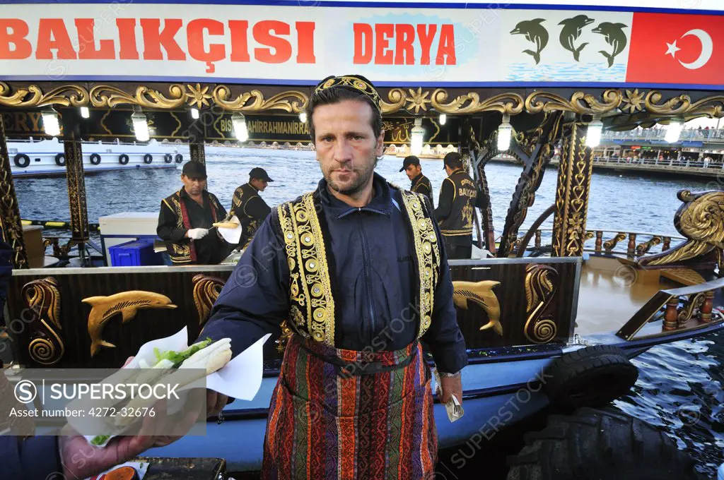 Fast food Turkish style, mackerel seller on the waterfront at Eminonu, Istanbul, Turkey