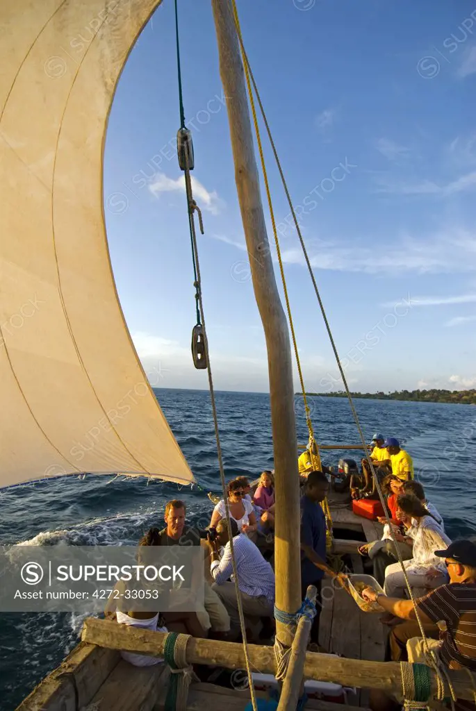 Sailing a traditional Dhow at sunset, Fundu Lagoon Resort, Pemba Island, Zanzibar, East Africa