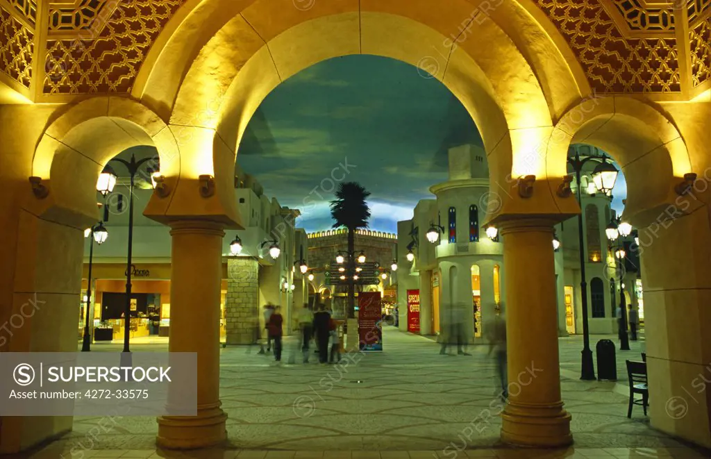 United Arab Emirates (or UAE), Dubai. False skies with clouds lend an outdoor atmosphere to Tunisia Court in the Ibn Battuta Shopping Mall.