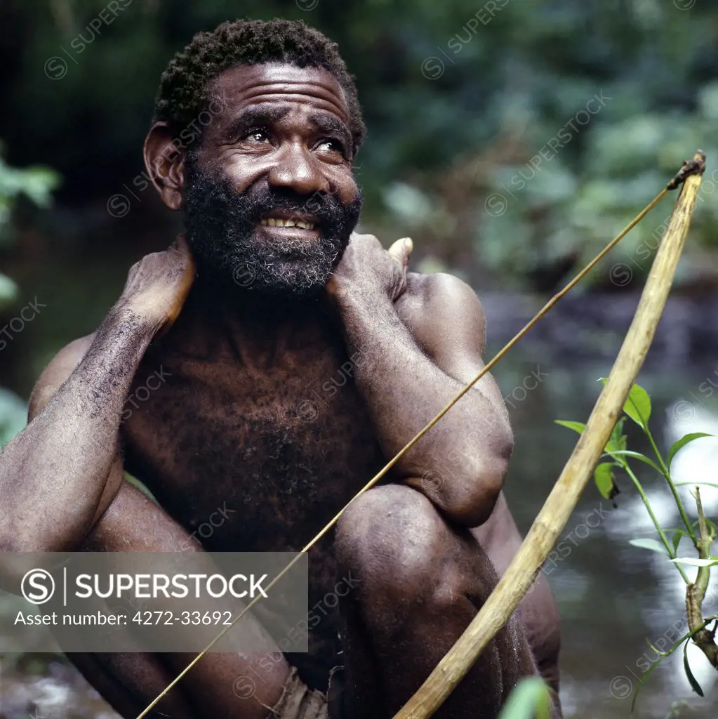 Scattered bands of Batwa pygmies hunt and fish in the Semliki Forest of Western Uganda, an extension of the vast Ituri rainforest of the Congo DRC. Rarely more than five feet tall, the Batwa are of mixed ancestry, being on average six inches taller than their Bambuti pygmy cousins who live deep inside the Congo rainforests.