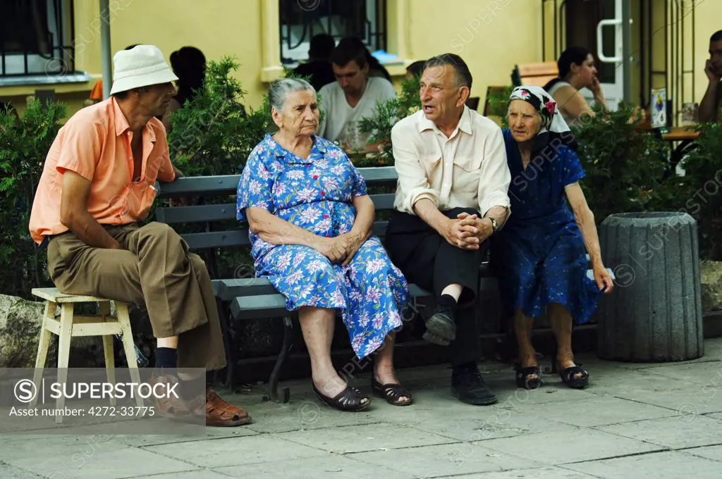 Old Locals Talking on Bench