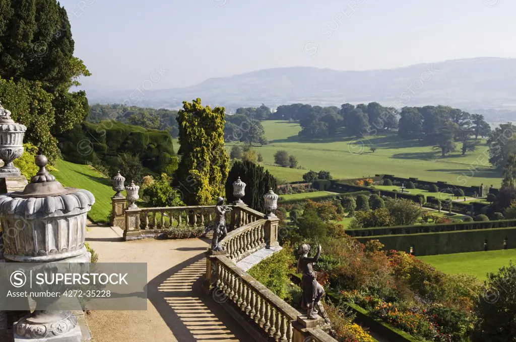 Wales; Powys; Welshpool. View over the Aviary Terrace with its Italianate sculptures of shepherds and shepherdesses and ornate ballustrading at the spectacular garden at Powis Castle