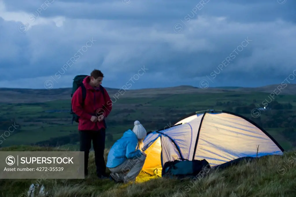 Gilar Farm, Snowdonia, North Wales.  Man and woman camping in the wild. (MR)