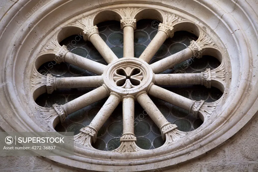 Croatia, Trogir, Central Europe. Detail of a window on a church. UNESCO