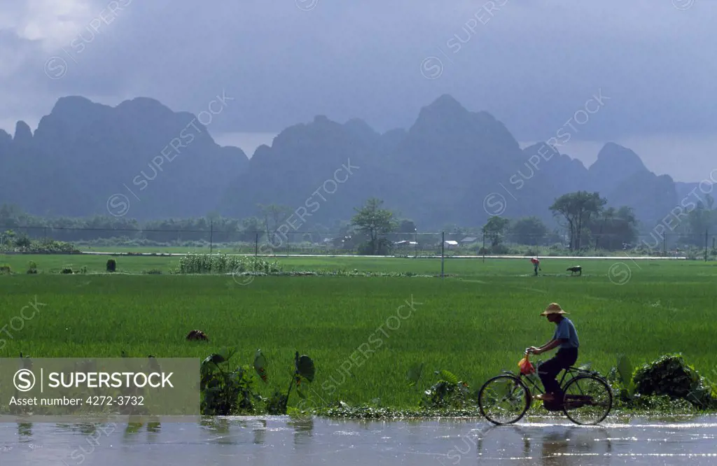 Cycling on flooded road after storm.