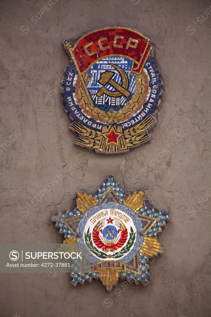 Sakhalin, Yuzhno-Sakhalin, Russia; Badges dating back to the Soviet Union on a wall