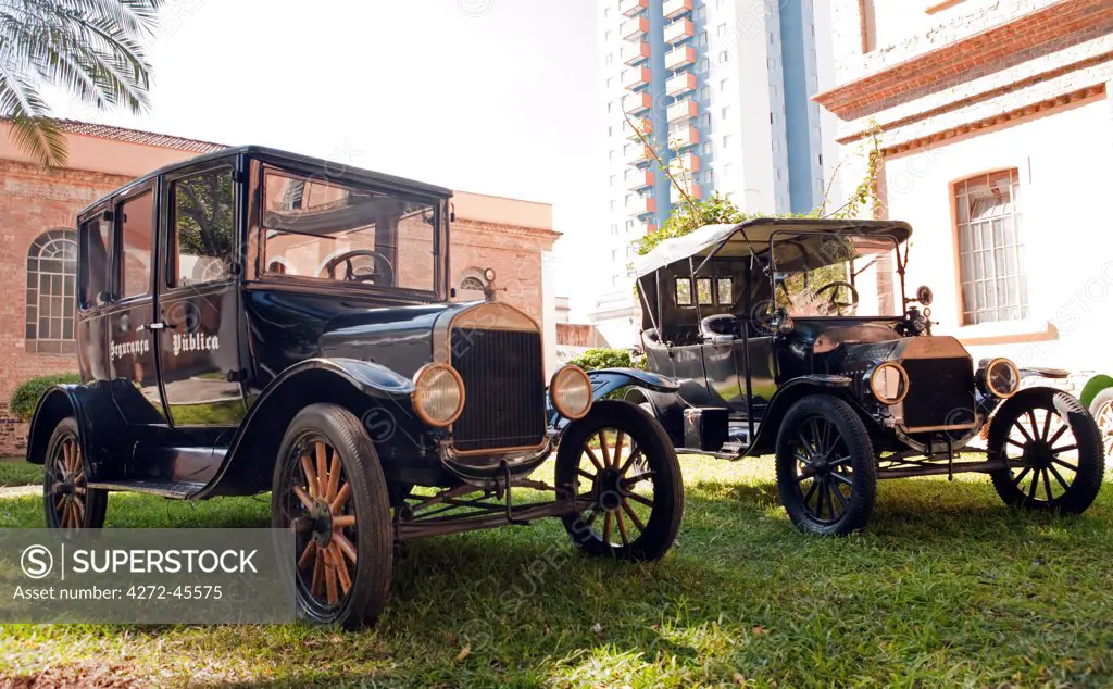 South America, Brazil, Sao Paulo, vintage Ford police cars outside the Memorial do Imigrante immigration museum in Mooca neighbourhood in Central Sao Paulo