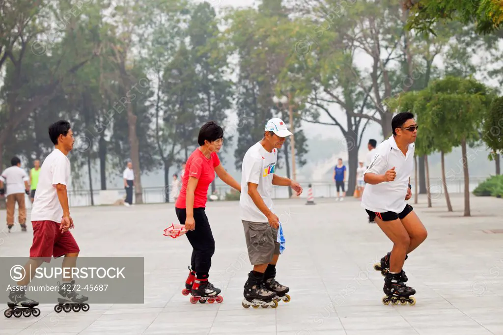 China, Tianjin. Rollerblading in Shuishang Park.