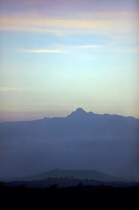 Kenya, Kenya Highlands. Dawn over Mount Kenya which rises 17,058 feet above sea level on the equator. Mount Kenya is the second highest mountain in Africa.