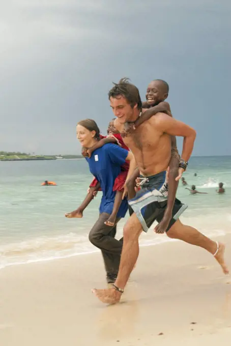 Volunteers playing with local children, Mombasa, Kenya