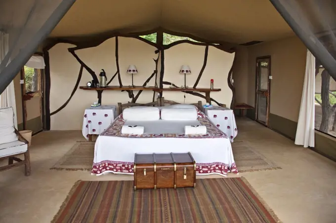 Kenya, A bedroom at Sarara Camp, a luxurious ecolodge situated near the magnificent Mathews Mountains of Northern Kenya.